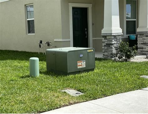 green electric box at fence|residential electrical boxes.